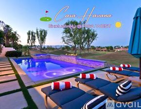 La Quinta house for rent - A poolside scene with a sign that reads "Casa Harana Exclusive by PGA West."