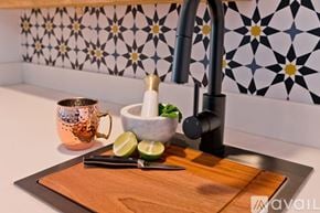 La Quinta house for rent - A kitchen counter with a sink, a bowl of lime, and a mug.