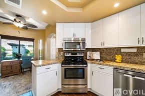 La Quinta house for rent - A kitchen with a stove top oven and a dishwasher.
