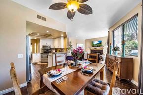 La Quinta house for rent - A dining room with a table set for two and a ceiling fan.