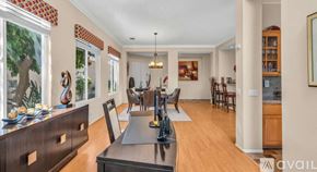 La Quinta house for rent - A modern kitchen with a dining table and chairs.