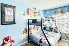 Kissimmee house for rent - A child's bedroom with a bunk bed and a teddy bear.