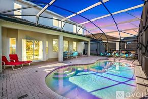 Kissimmee house for rent - A pool in a house with a glass ceiling.