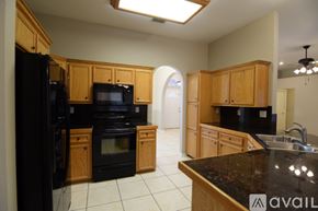 Harker Heights house for rent - A kitchen area with a counter and cabinets.