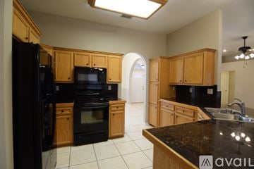 Harker Heights house for rent - A kitchen area with a counter and cabinets.
