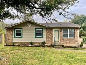 Oldham house for rent - A house with a green front door and a brown front porch.