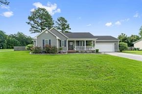 Jacksonville house for rent - A house with a grey roof and a green lawn.