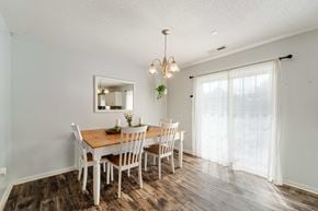 Jacksonville house for rent - A dining room with a wooden table and chairs.