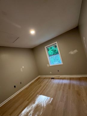 Atlanta house for rent - A room with a window and wooden flooring.