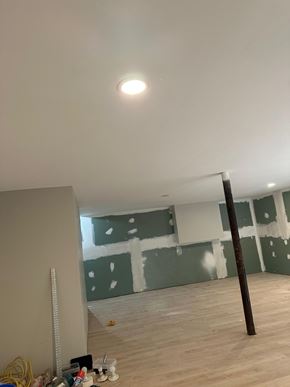 Atlanta house for rent - A room with a wooden floor and a white ceiling with a light fixture.