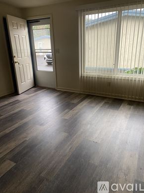 Salem apartment for rent - A room with a white door and a window with blinds.
