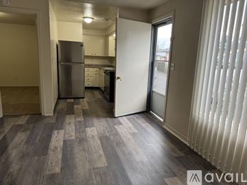 Salem apartment for rent - A kitchen with a refrigerator and a dining table.