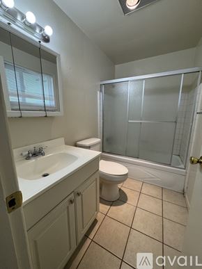 Salem apartment for rent - A bathroom with a toilet, sink, and shower.