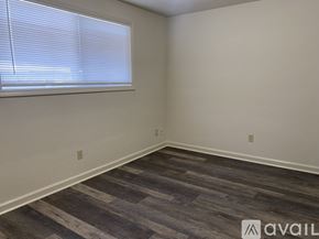 Salem apartment for rent - A room with a window and wooden flooring.