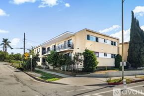 Los Angeles apartment for rent - A staircase with a metal railing and steps leading upwards.