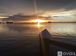 Fort Myers condo for rent - A kitchen with wooden cabinets and a white sink.