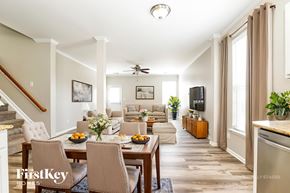 Burlington house for rent - A well-lit dining room with a table set for a meal.