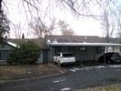 Pullman apartment for rent - A car is parked in front of a house.