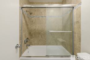 Los Angeles apartment for rent - A shower area with a glass door and a glass shower head.
