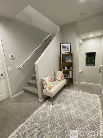 Chula Vista house for rent - A living room with a grey carpet and a wooden bench.