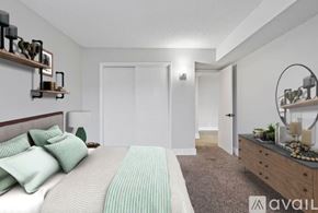 Nashville apartment for rent - A bedroom with a bed, nightstand, and a mirror.