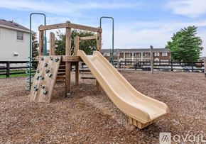Nashville apartment for rent - A playground with a slide and a climbing structure.