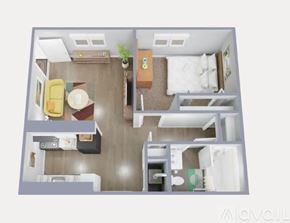 Nashville apartment for rent - A living room with a couch, a chair, and a potted plant.