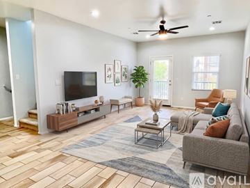 Phoenix apartment for rent - A kitchen with white cabinets and a white island.