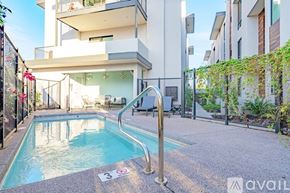 Scottsdale apartment for rent - A pool with a 3 people maximum sign in front of a building.
