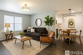 Dallas apartment for rent - A room with wooden flooring and a window with blinds.