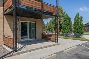 Lakewood apartment for rent - A modern building with a balcony and a glass door.