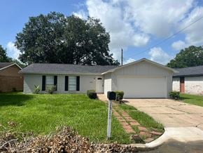 Bay City house for rent - A house with a white garage door and a brick chimney.
