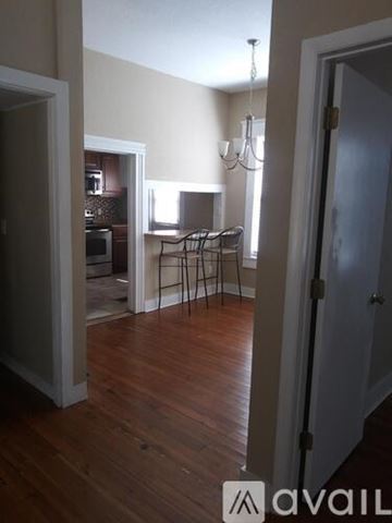 Winter Park apartment for rent - A kitchen with brown cabinets and a granite countertop.
