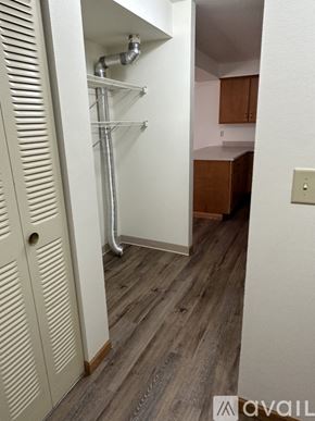 Pekin house for rent - A white door with a vent on the side is open to a kitchen.