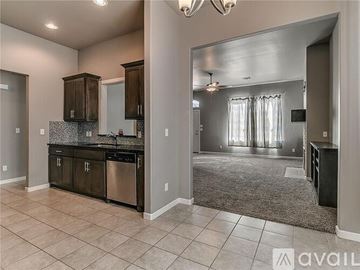 Oklahoma City house for rent - A kitchen with a dishwasher and a refrigerator.