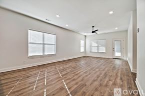 Mountain Home house for rent - A spacious room with wooden flooring and a ceiling fan.