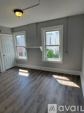 Newburgh apartment for rent - A room with a grey wall and a white door.