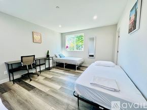 Los Angeles apartment for rent - A bedroom with a bed, desk, and chair.