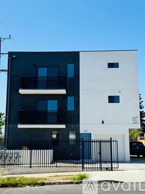Los Angeles apartment for rent - A modern two-story building with a black and white exterior.