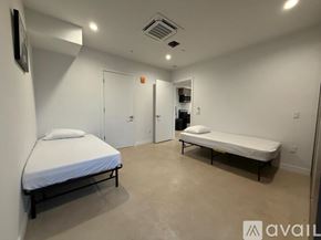 Los Angeles apartment for rent - A bedroom with a bed and a bench in it.
