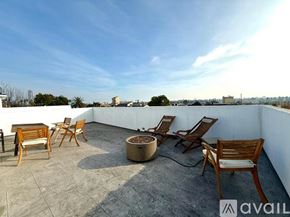 Los Angeles apartment for rent - A patio with chairs and a table is available for rent.