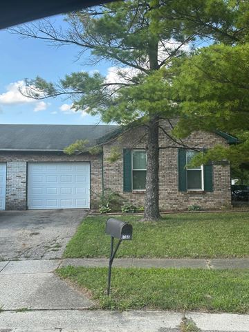 Galloway apartment for rent - A brick house with a white garage door and a mailbox.