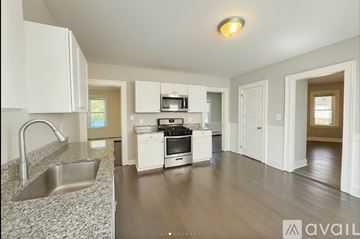 New Britain apartment for rent - A kitchen with white cabinets and a stainless steel sink.