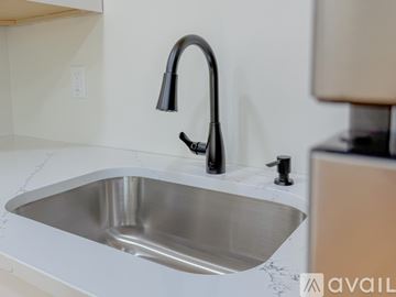 New Britain apartment for rent - A modern kitchen sink with a black faucet.