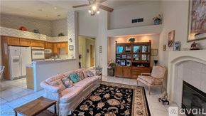 Las Vegas house for rent - A bedroom with a large bed and a window with curtains.