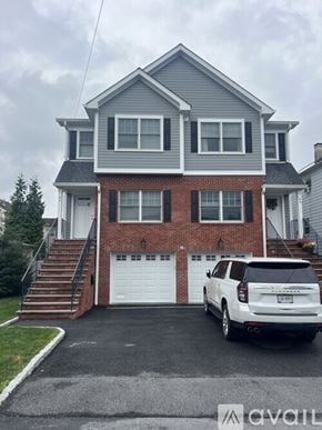 Harrison townhouse for rent - A kitchen with granite countertops and white cabinets.