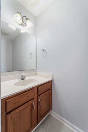 Jacksonville house for rent - A bathroom with a sink and a mirror.