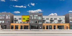 Denver house for rent - A modern building with a yellow square in the middle of it.