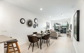 Denver house for rent - A modern dining room with a table set for four.
