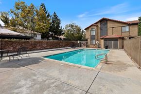 Riverside apartment for rent - A house with a pool in the backyard.